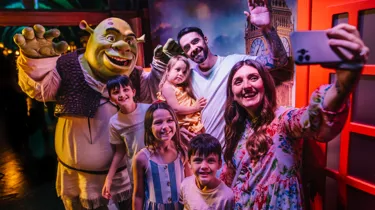 A family posing at Shrek’s Adventure! In London.