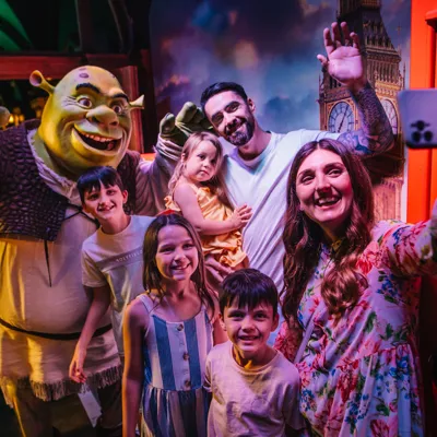 A family posing at Shrek’s Adventure! In London.